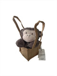 Load image into Gallery viewer, Playful and happy, fluffy dark chocolate coloured plush monkey head resting adorably on its paws, sitting propped up in a natural, brown hessian jute bag
