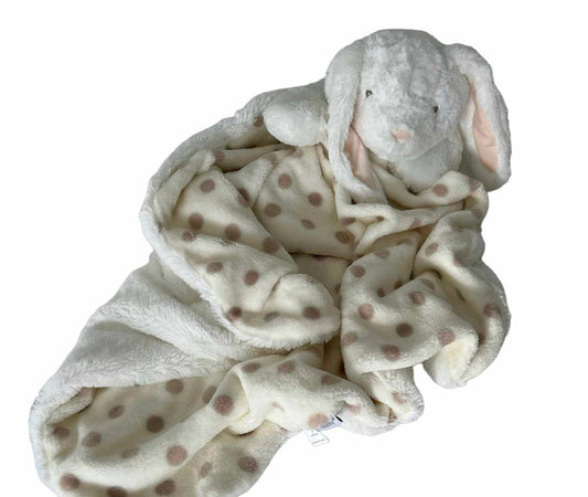 Super fluffy white plush bunny head and paws attached to a butter cream with hazelnut coloured polka dots on top layer of a sizeable blanket with a fresh white, super soft long plush layer underneath gently laying looking adorably soft and comfortable