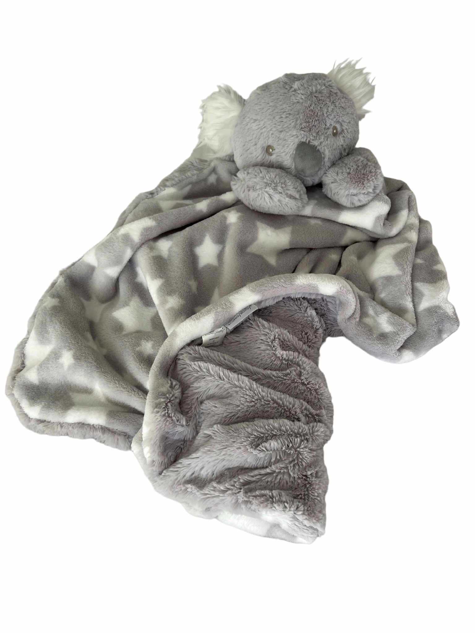 A precious, gentle, stormy-cloud grey Koala plush toy head with fluffy white fur inside its ears and 2 gentle paws resting on a luxuriously large, 2 layer stormy grey-cloud blanket with fresh white stars and an underlay of that same calming stormy-cloud colour of cozy long plush, laying settled and patient offering countless cuddles
